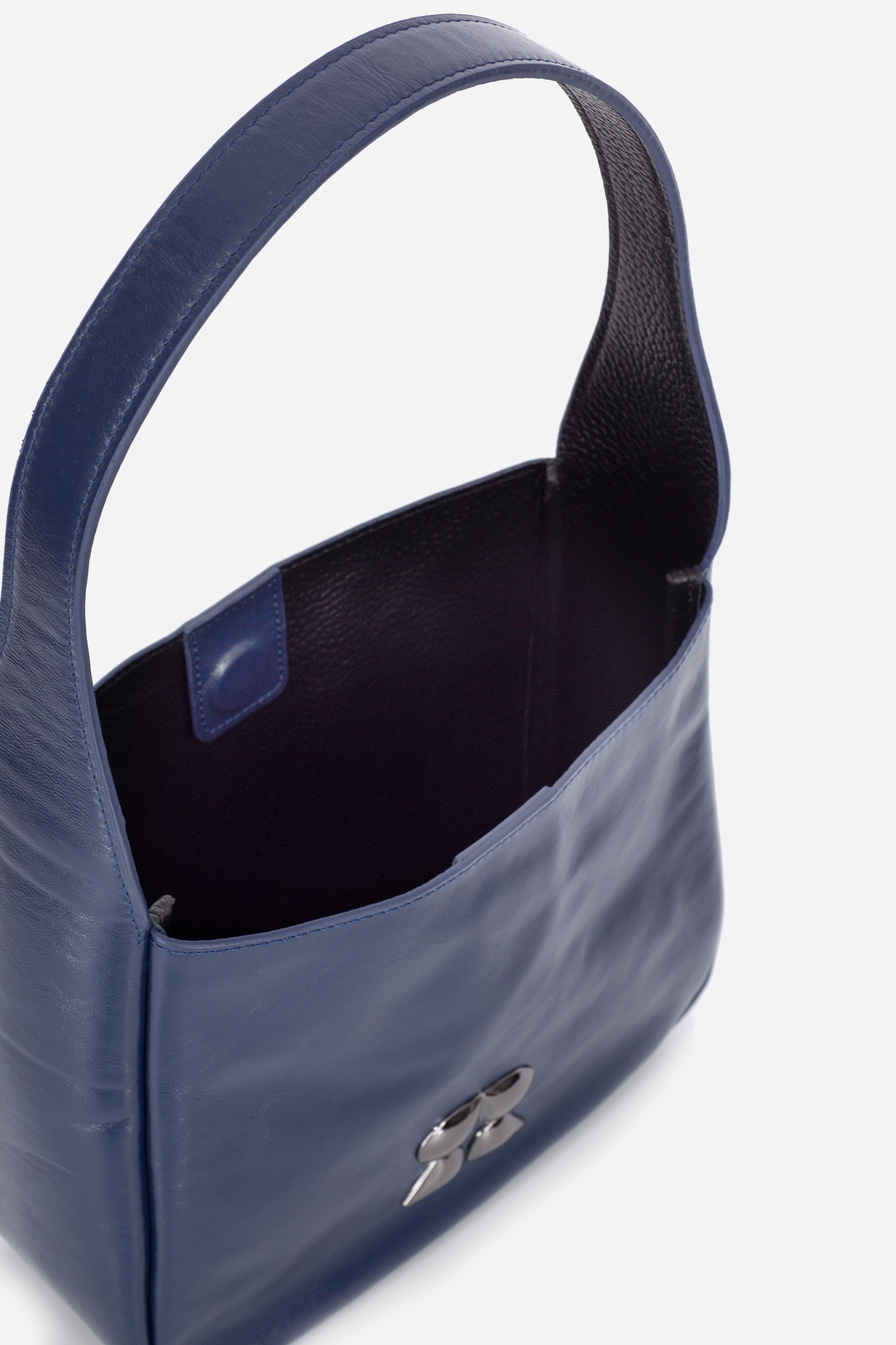 Rilu Camellia indigo leather shoulder bag close-up of contrasting interior/exterior leather