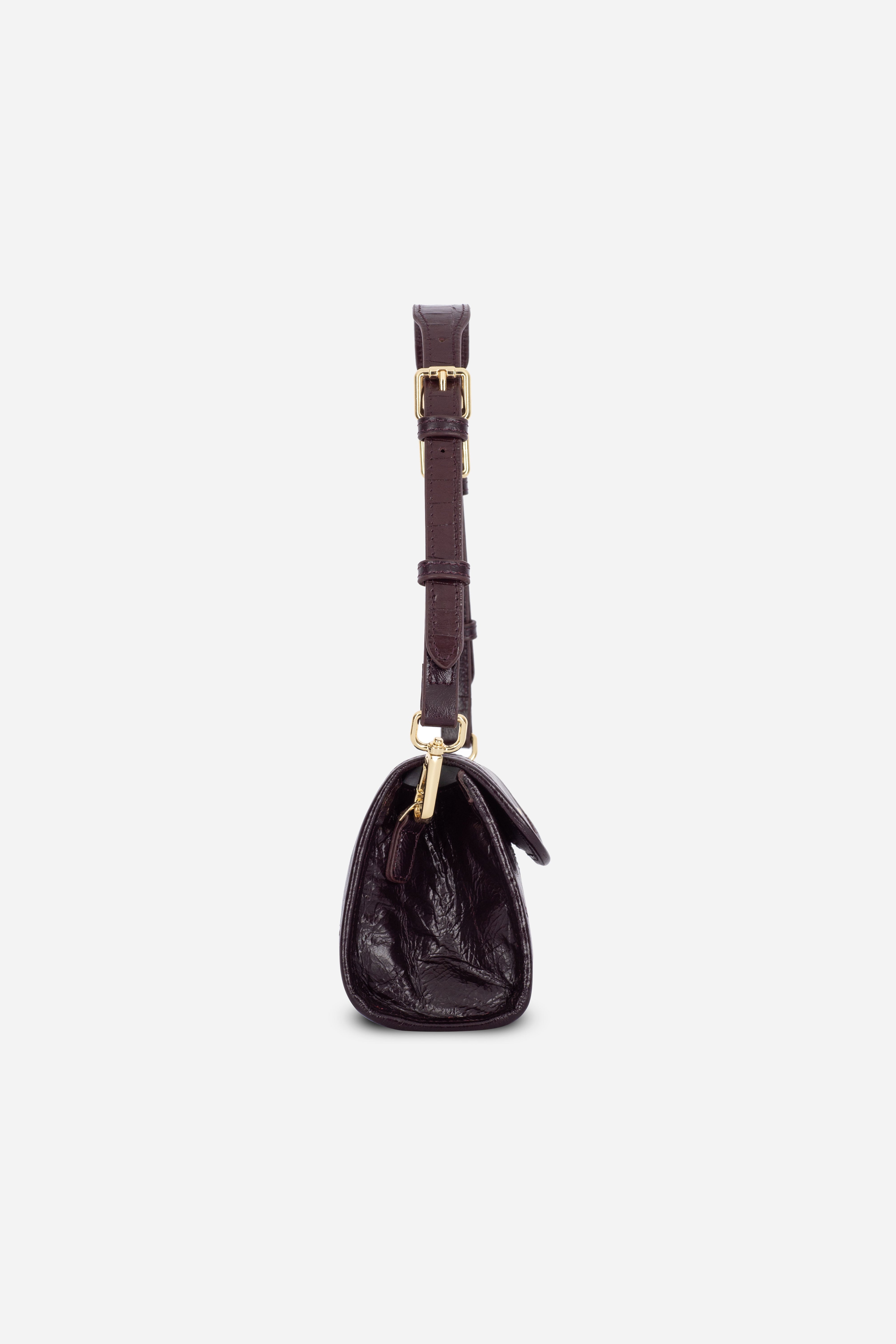 Angle view of the Rilu Elysia Burgundy leather mini bag with croc strap