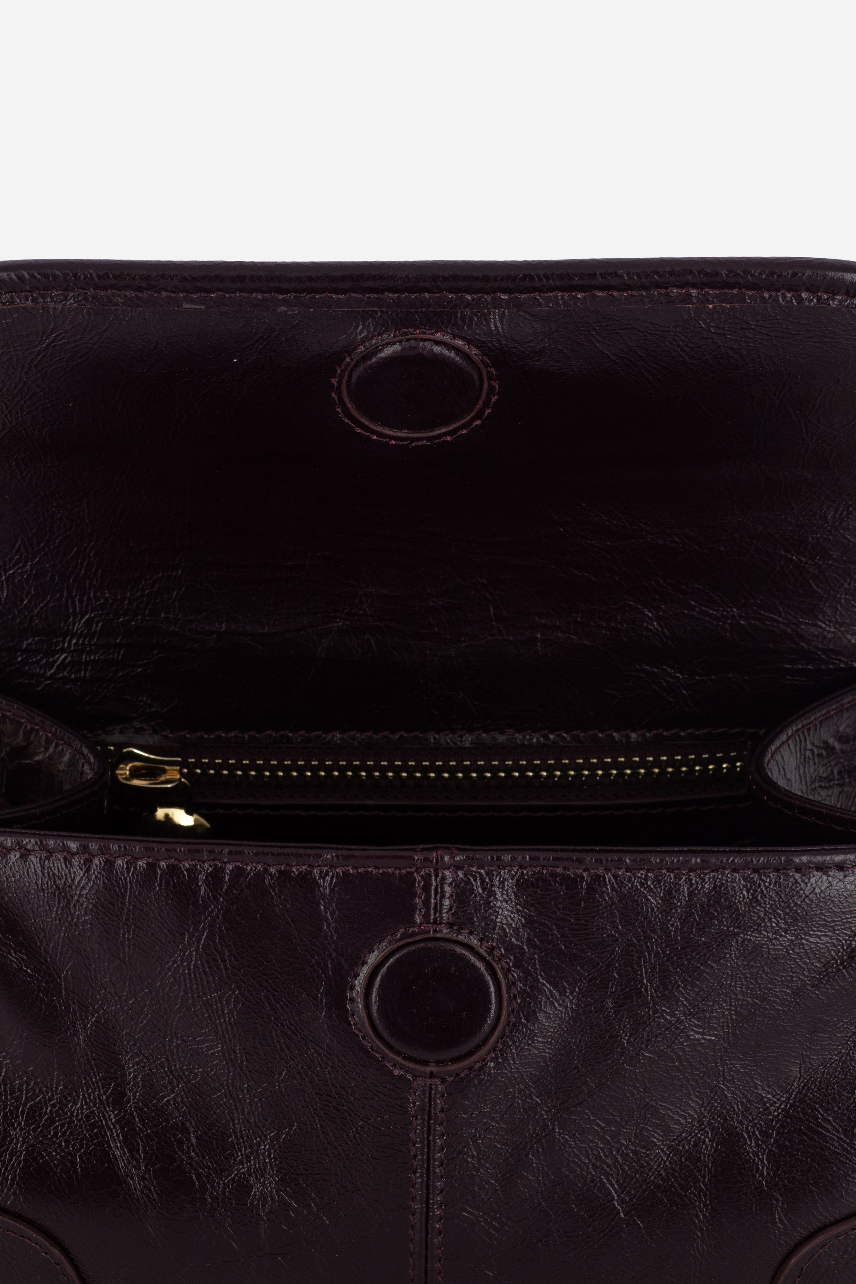 Close up view of the Rilu Elysia Burgundy leather mini bag with croc strap