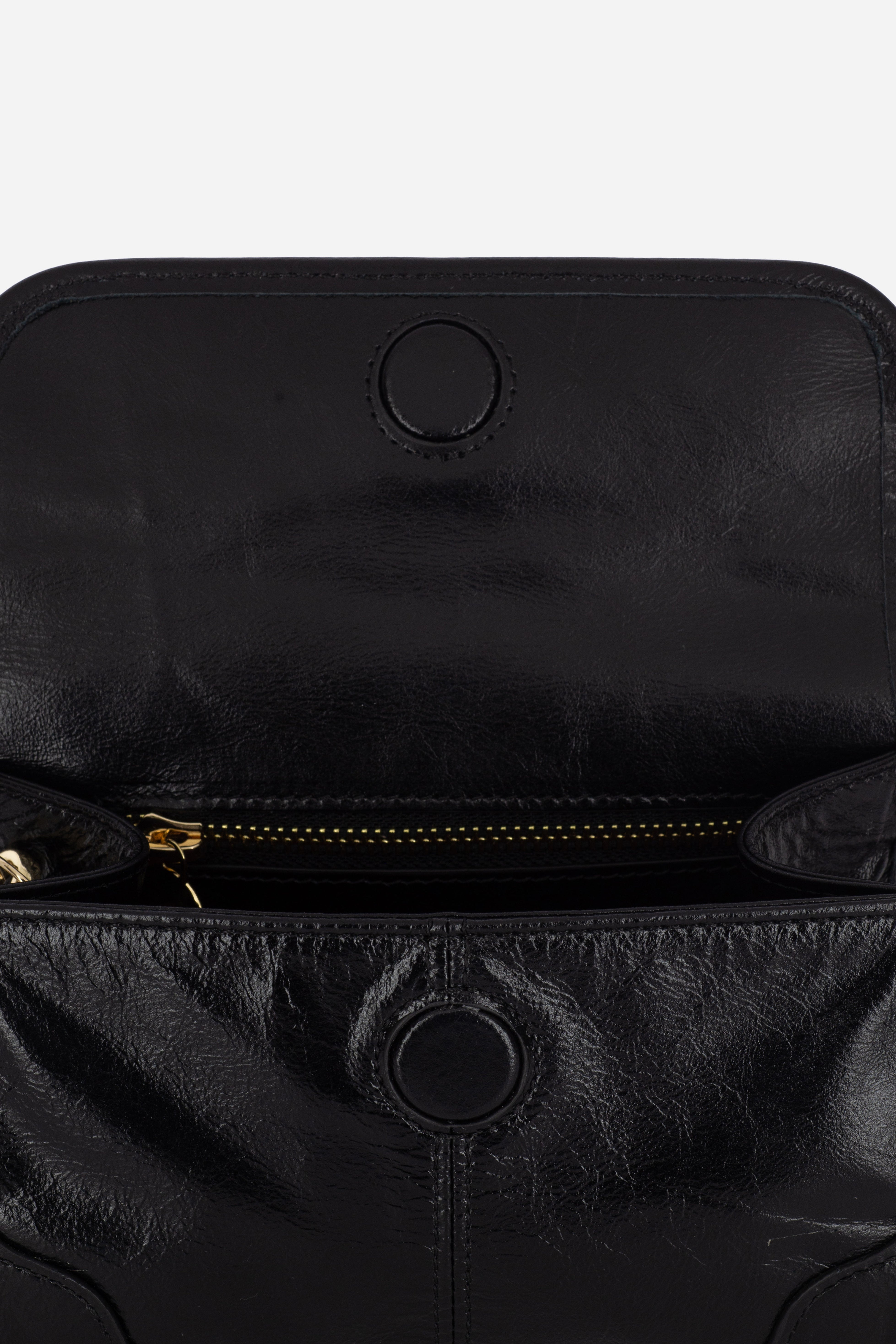 Close-up view of the Rilu Elysia Black leather mini bag with croc strap