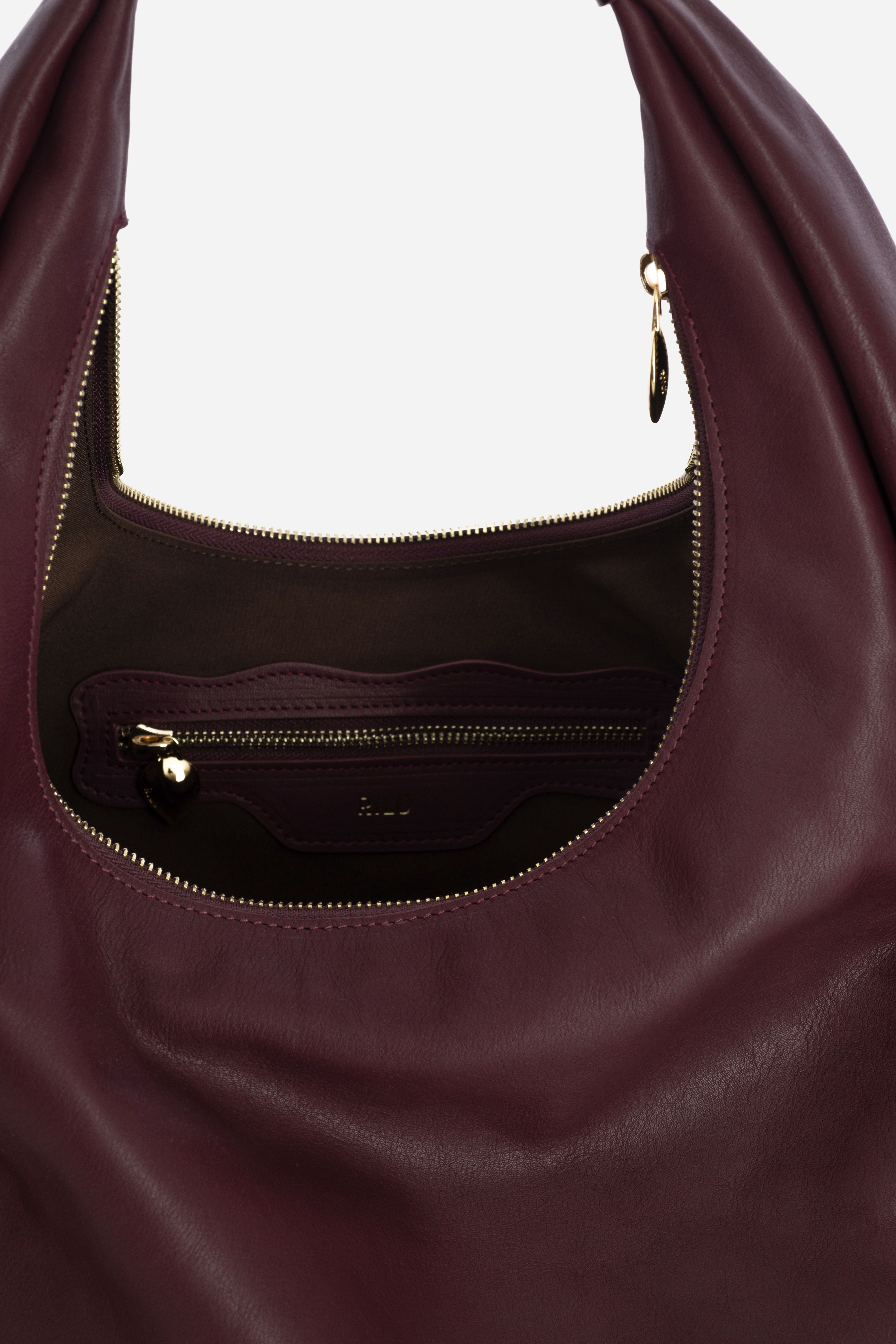 Rilu Hera burgundy leather hobo bag close-up of the strap detail and soft leather
