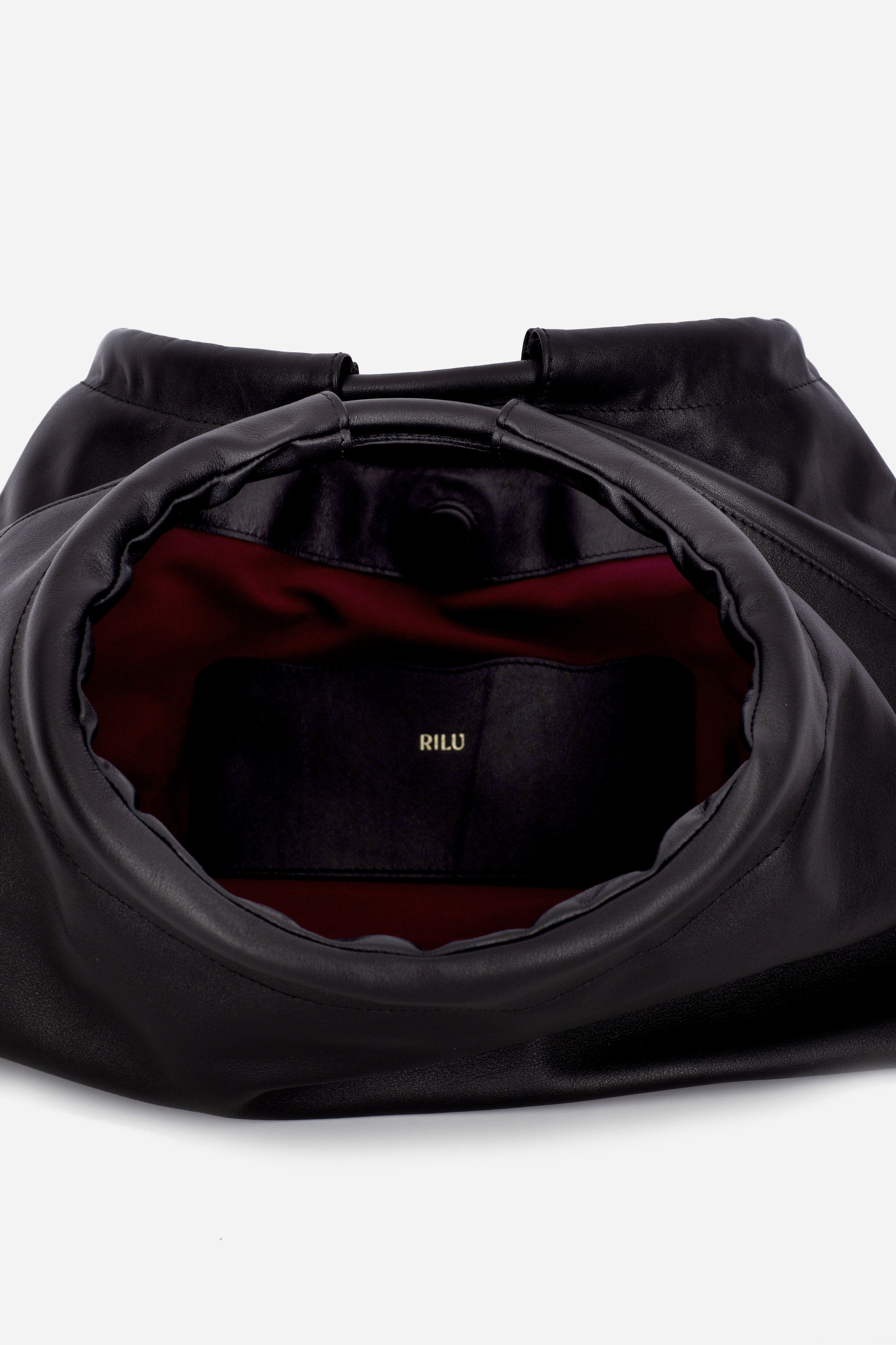 Rilu Sirena black leather shoulder bag close-up of ruched detail and soft leather