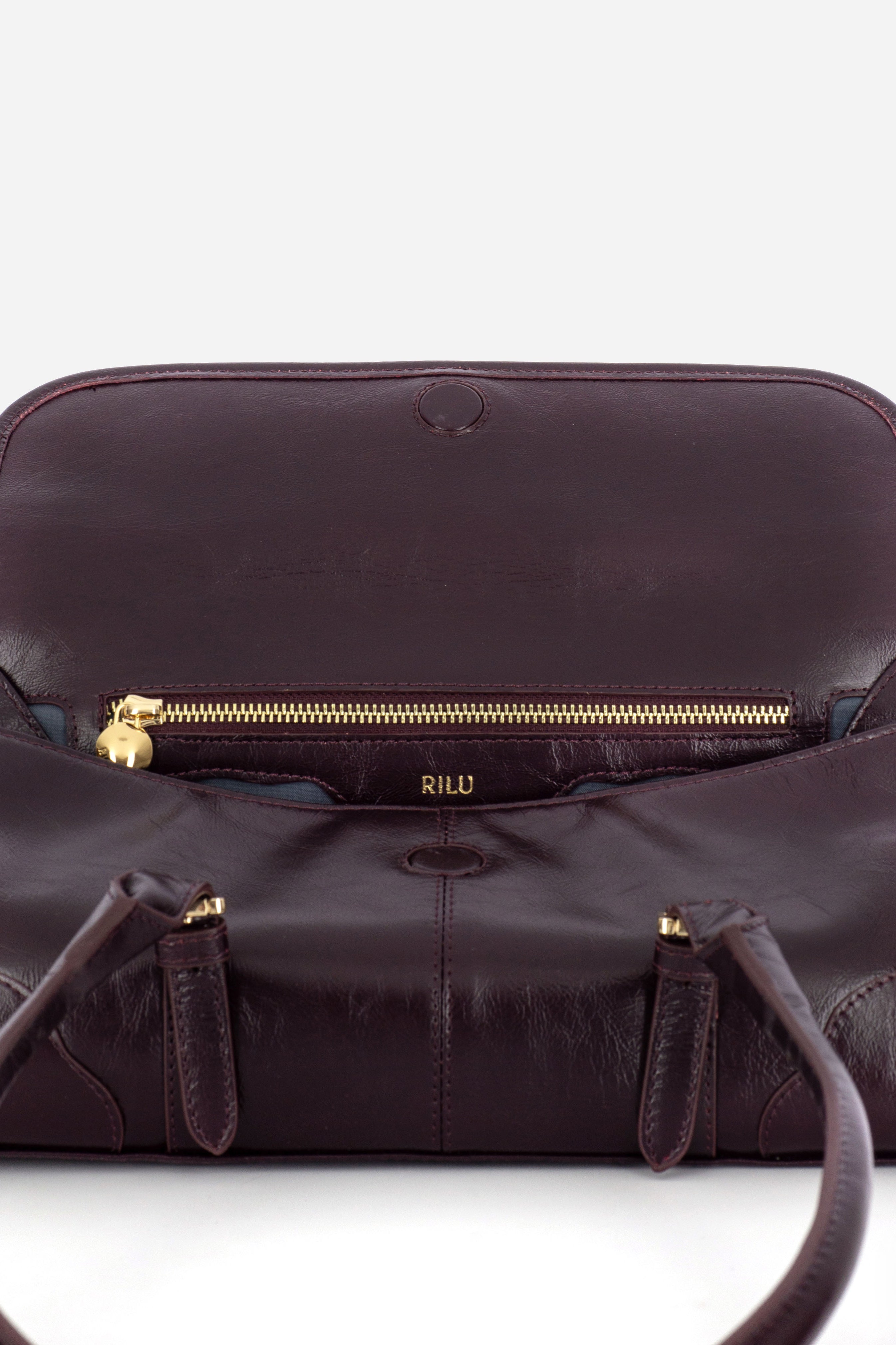 Rilu Amara burgundy leather shoulder bag close-up of thoughtful detail
