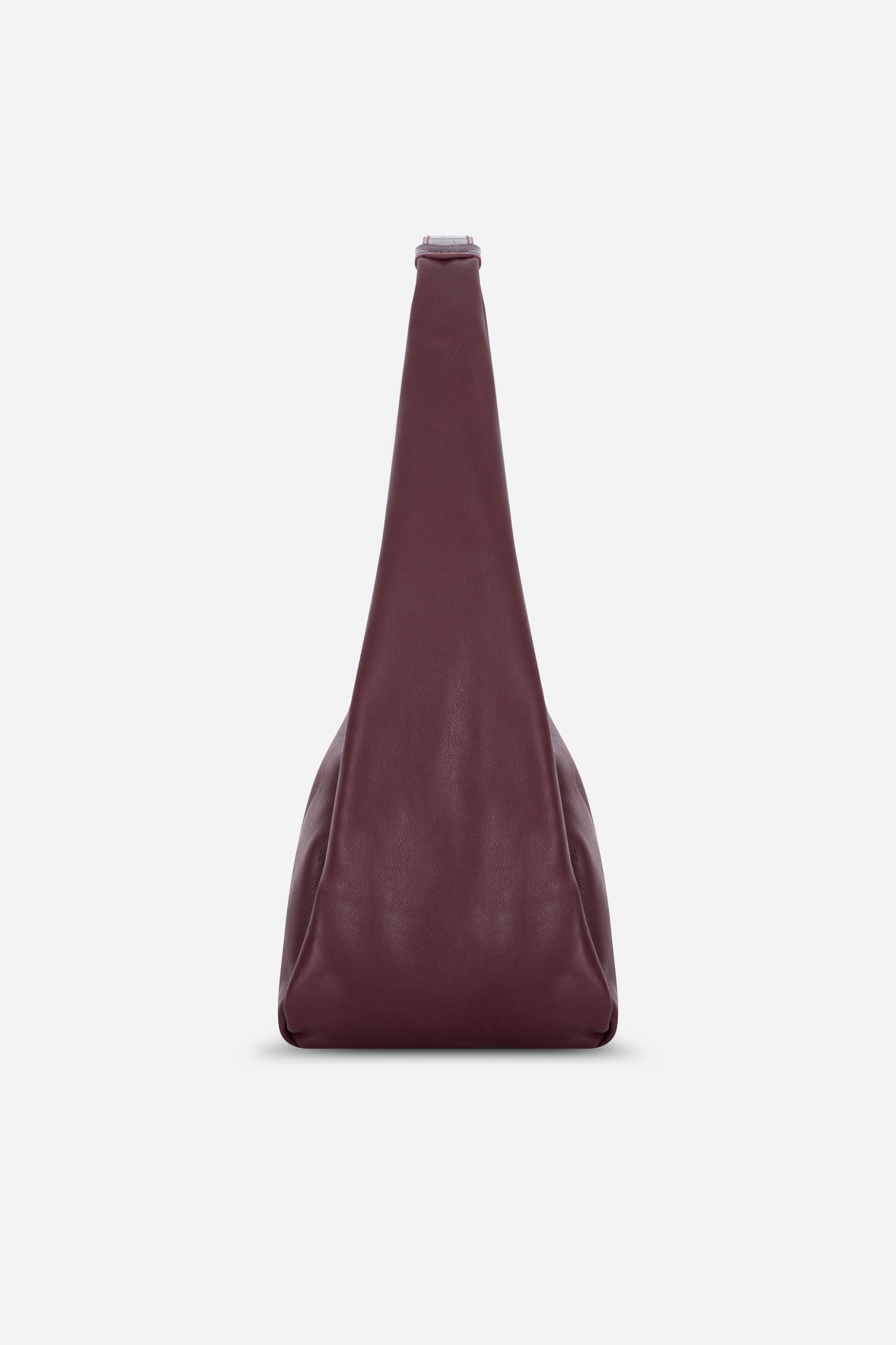 Rilu Hera burgundy leather hobo bag side view showing relaxed drape and volume