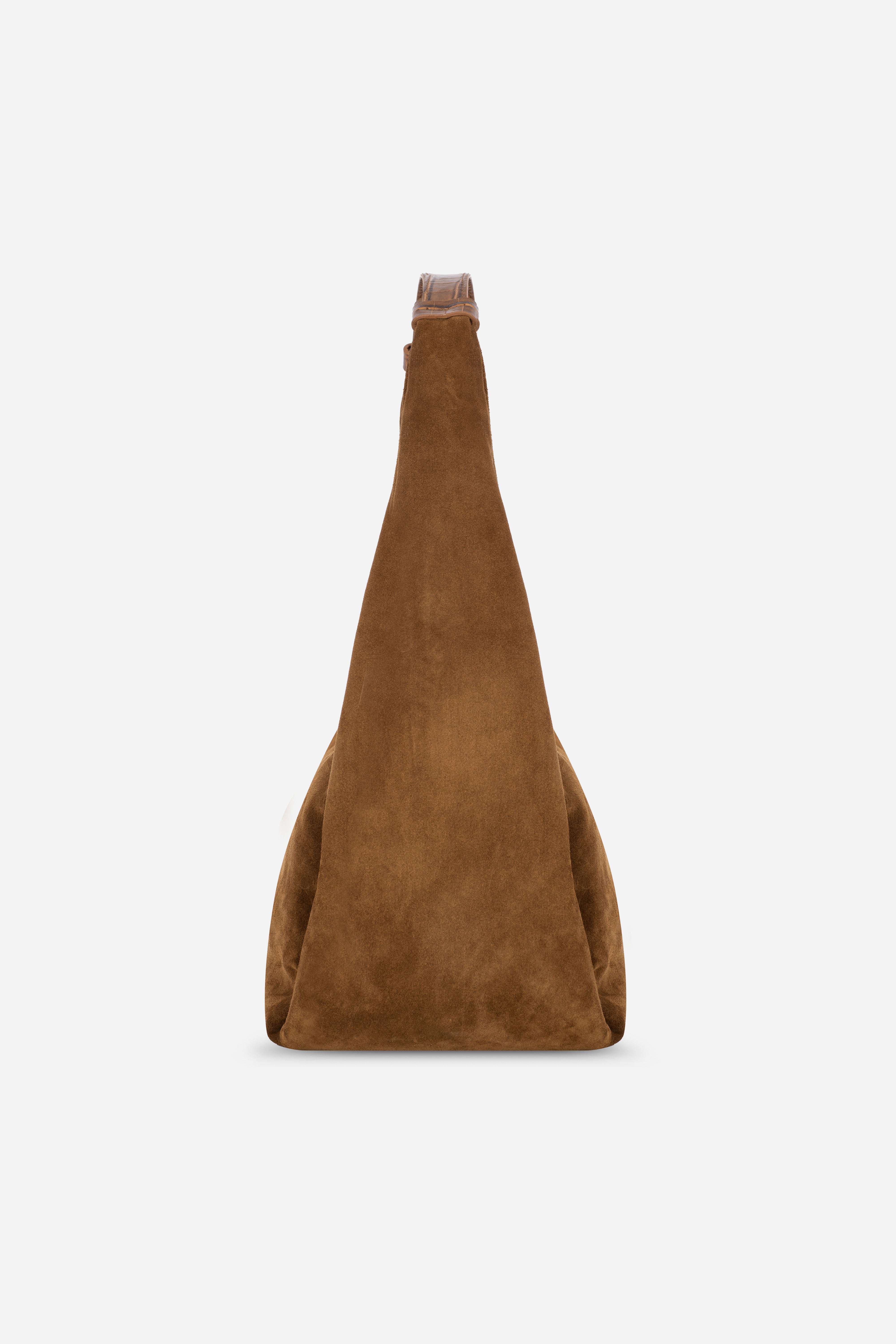 Rilu Hera toffee suede leather hobo bag side view showing relaxed drape and volume