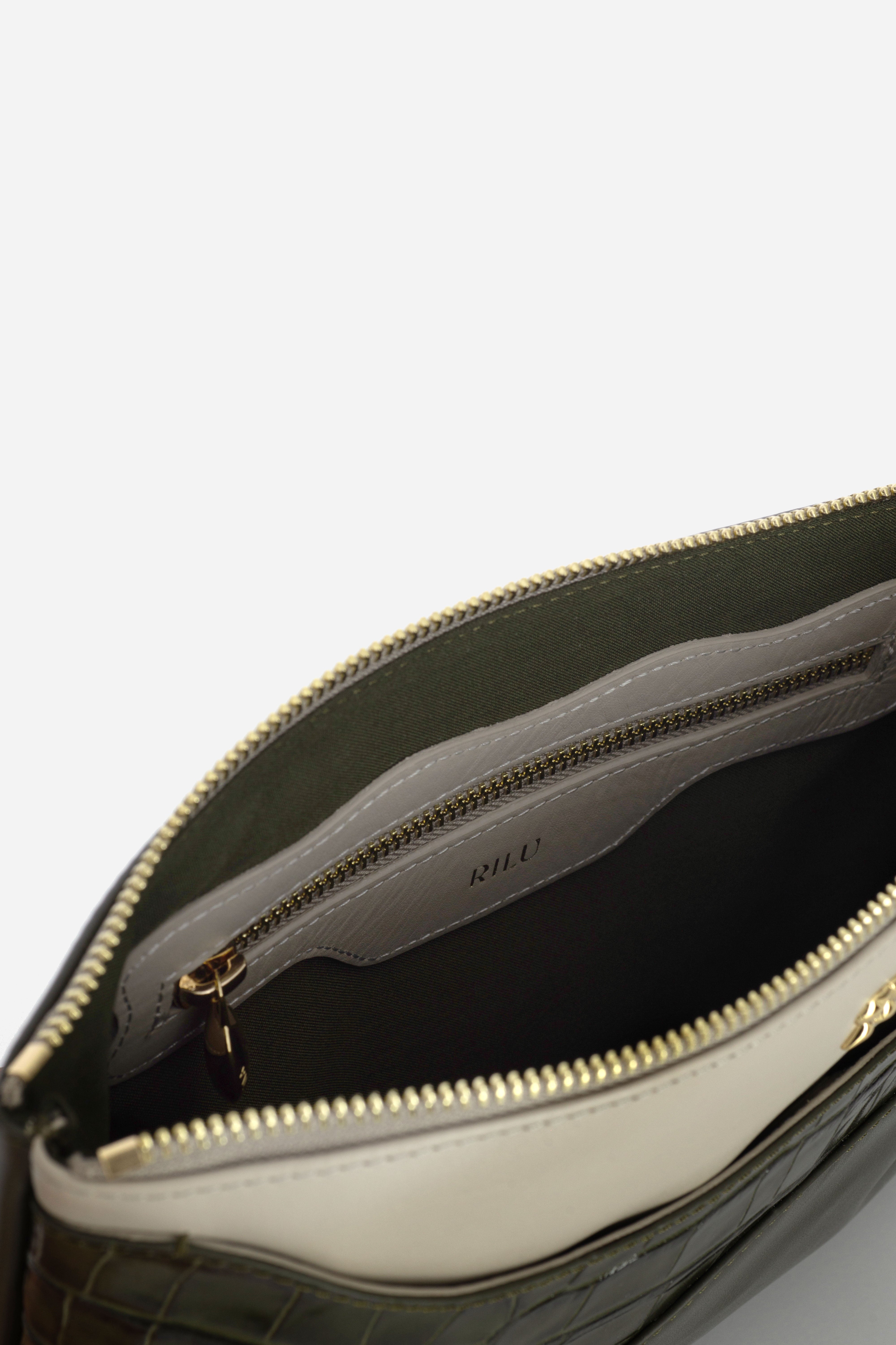 Rilu Ivy leather clutch close-up of the dark green croco print and leather fusion