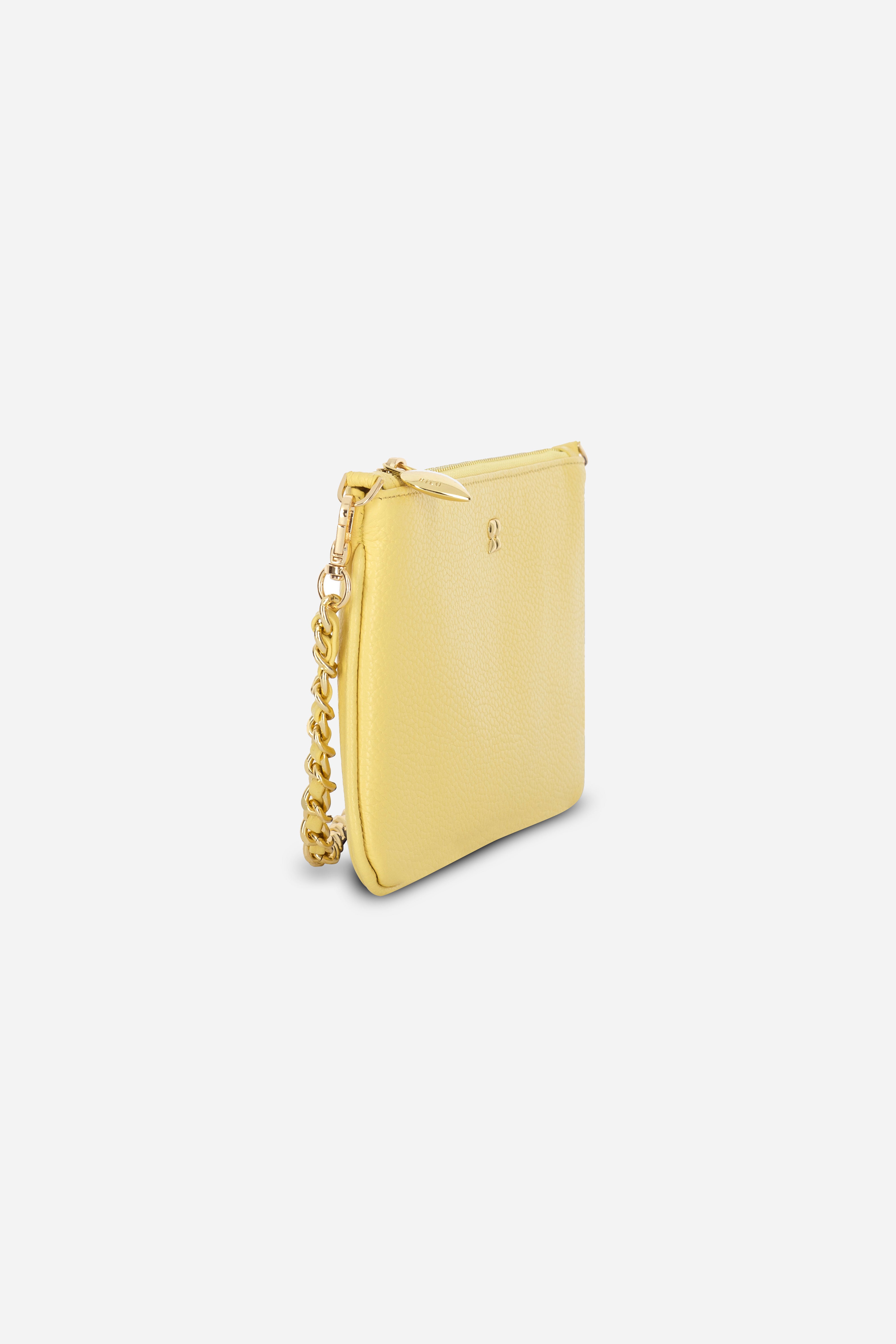 Rilu Kaia butter yellow clutch side view showing chain-and-leather handle