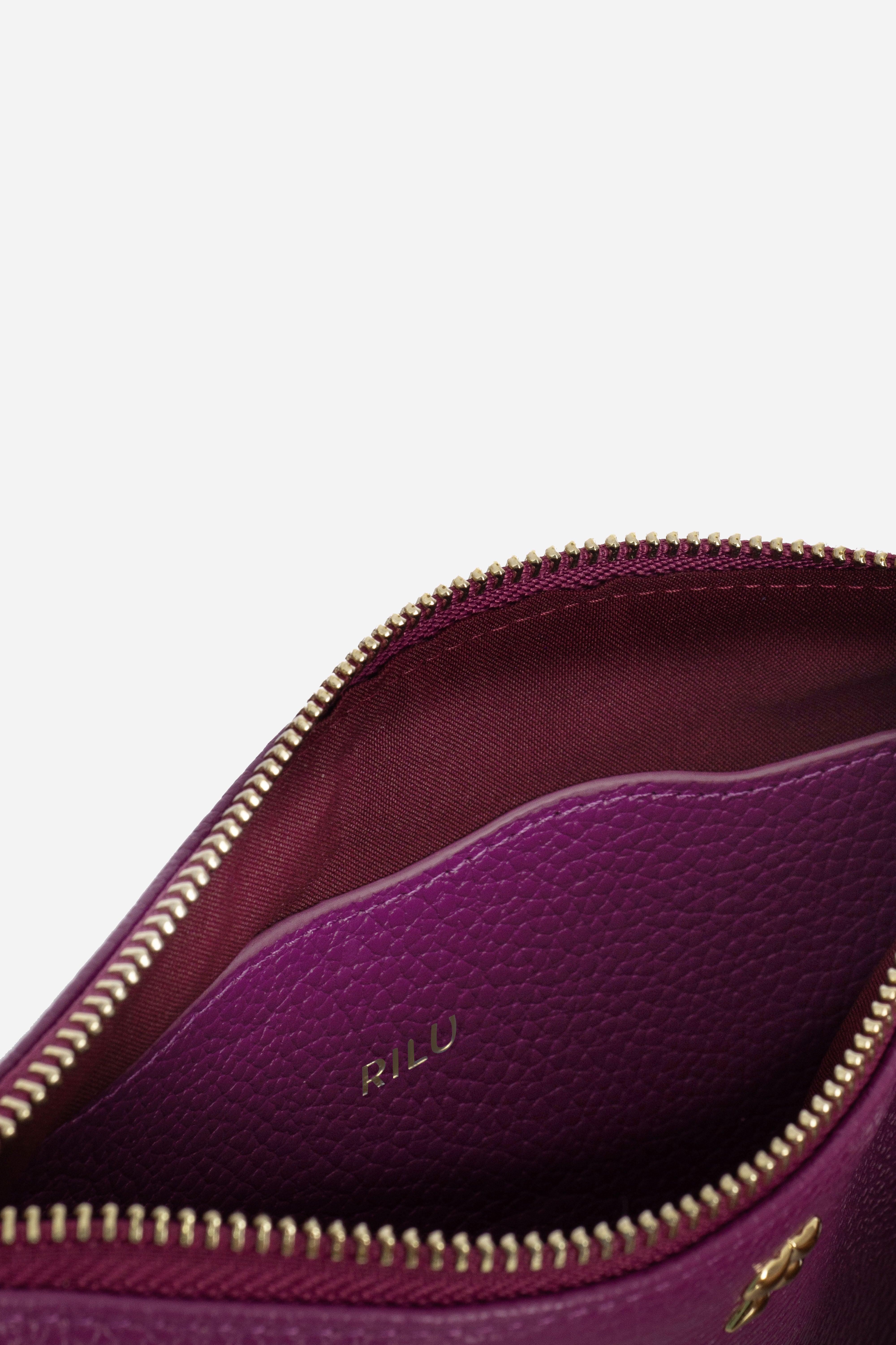 Rilu Kaia dark berry clutch close-up of Rilu charm and chain detail