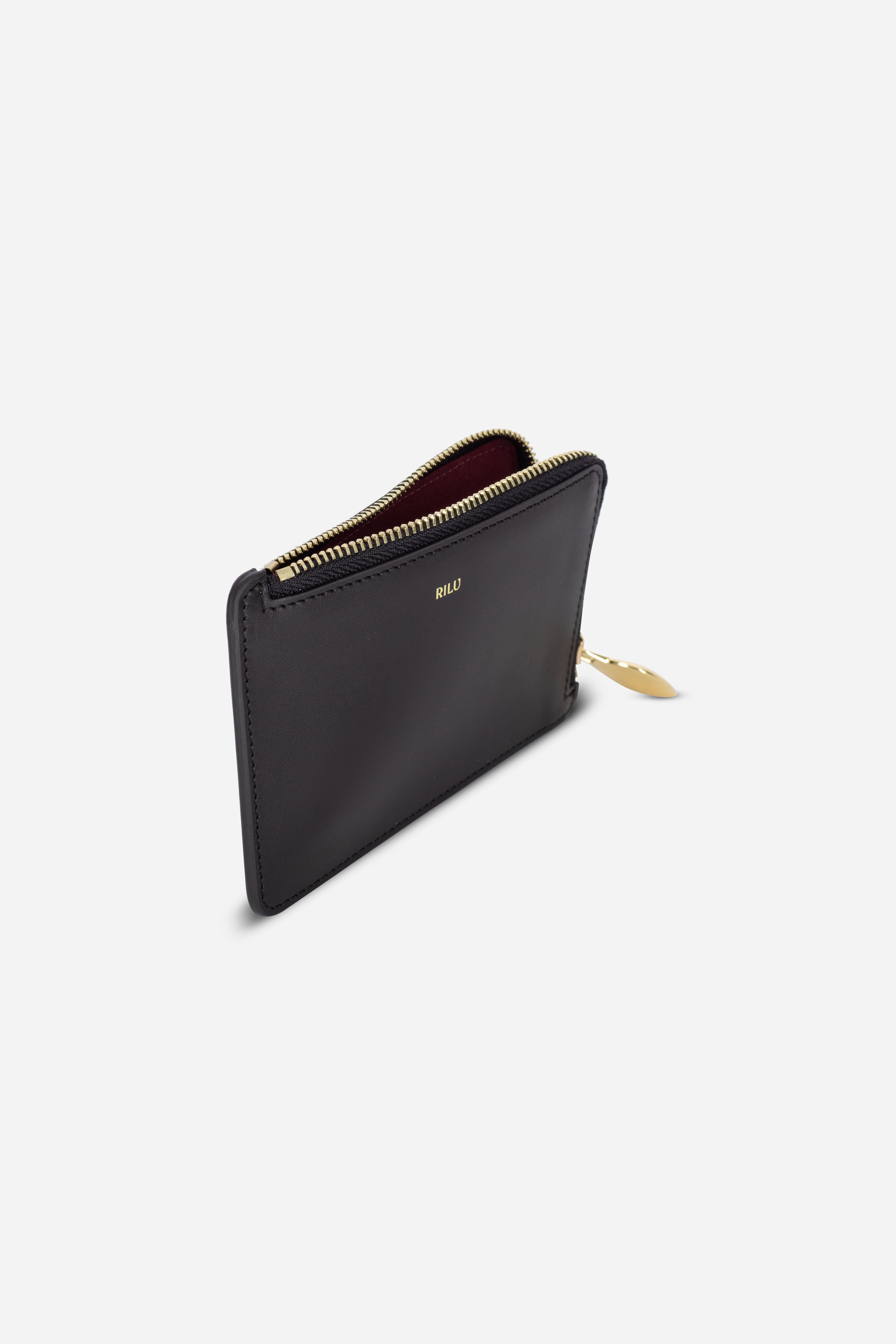 Rilu Nova black zipped leather card holder side view showing depth angle