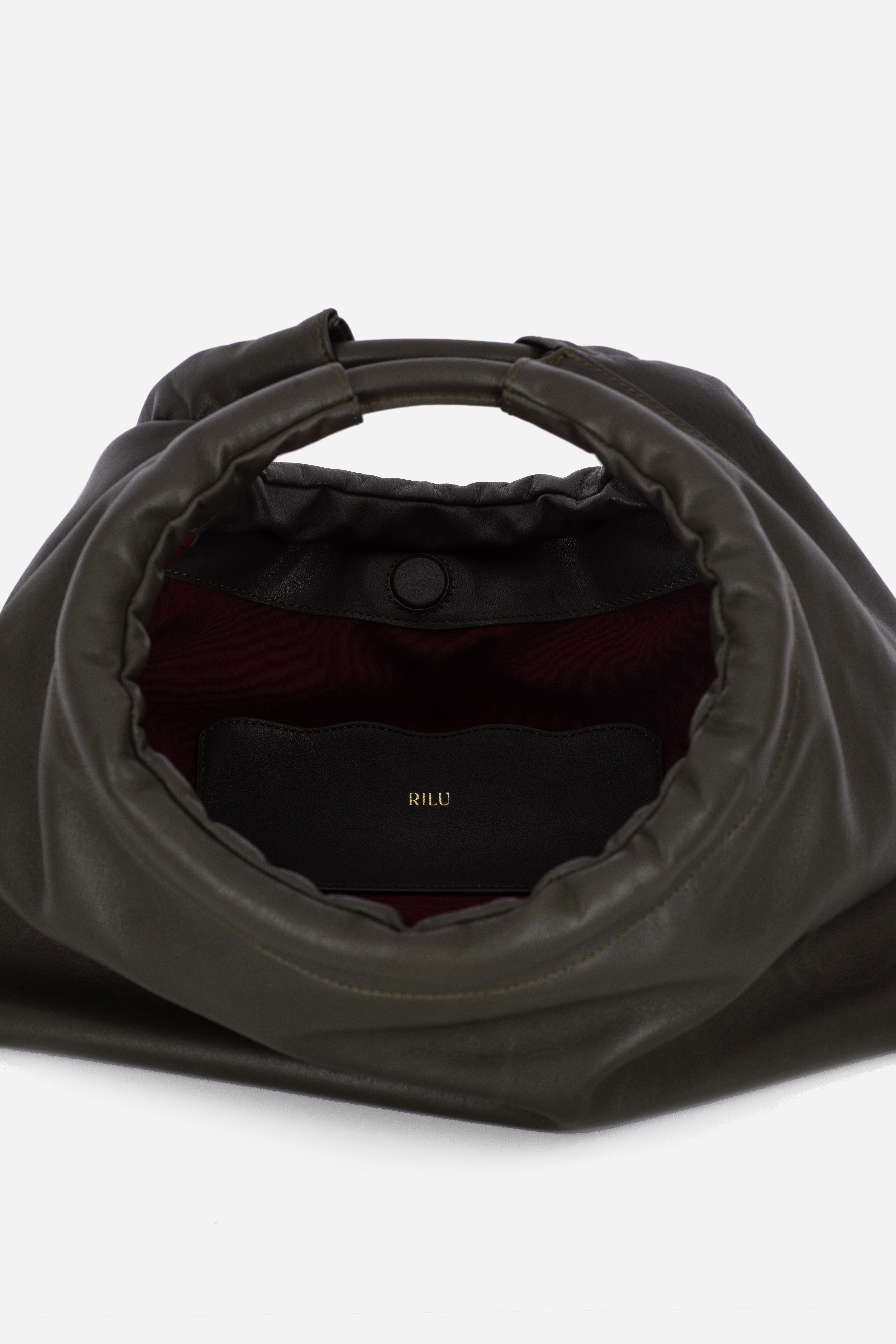 Rilu Sirena dark green leather shoulder bag close-up of ruched detail